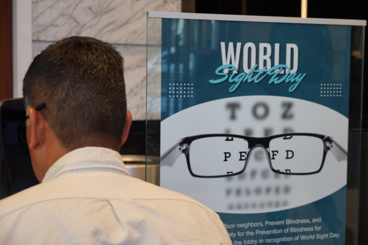 A vision screening participant at the screening device. A vision screening participant at the screening device.